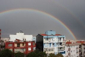 rainbow clouds sky building