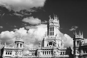 black and white photo of a castle against a background of white clouds