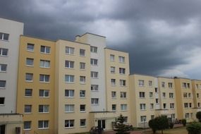 homes building architecture dark clouds sky