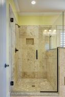 shower cabin with tile walls and floor, modern interior