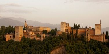 alhambra castle at foggy mountains, spain, granada