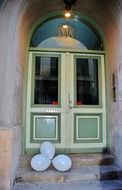 white balloons at old entrance door