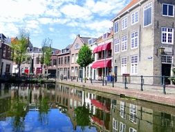 beautiful waterfront reflecting on channel, netherlands, schiedam