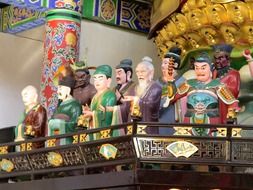 traditional human figures on shelf, china, fengcheng