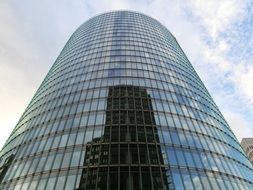 mirroring of building on glass facade, germany, berlin