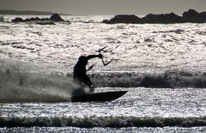 kitesurfer silhouette on wave