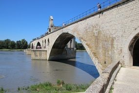 old bridge across calm river, france, avignon