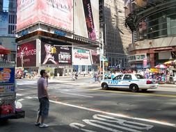 young man at road on times square, usa, manhattan, nyc