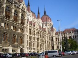 parked cars at parliament building, hungary, budapest