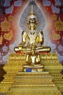 spiritual golden buddha statue in thai temple in thailand