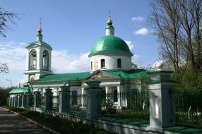 orthodox church building with bright green roof, russia