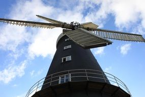 low angle view of old windmill at sky