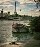 boats on river in view of eiffel tower, france, paris