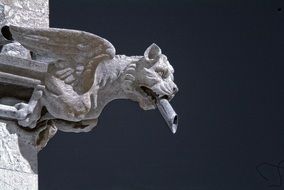 stone carved winged beast, gargoyle