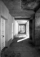 black and white image of a passage in a building