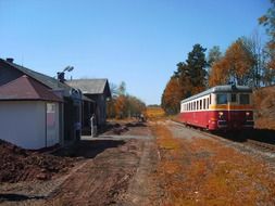 old passenger train at small station in countryside, czech republic, chvalec