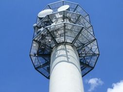 broadcasting tower with antennas at sky