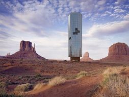 modern tower in monument valley, collage