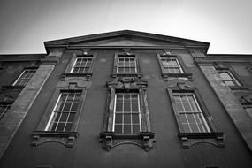 facade of old luxury mansion at sky