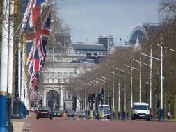 flags on street in city, uk, england, london