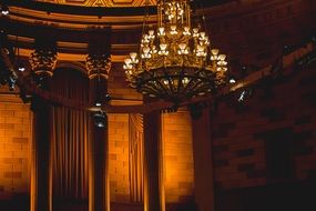 luxury antique chandelier under ceiling of hall