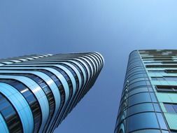 low angle view of two tall buildings at sky, netherlands