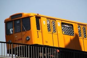 yellow metro train at sky, germany, berlin