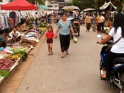 people on street market, laos, luang prabang