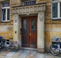 bicycles on street at door of old building, germany, dresden