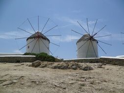 two old windmills at sky, greece