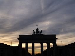 brandenburg gate silhouette at evening sky, germany, berlin