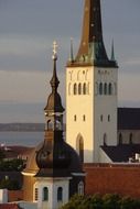 medieval towers of St Olaf's Church at evening sky, estonia, tallinn