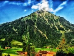 village near niesen montain at summer, switzerland