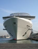 front view of modern cruise ship at pier, spain, barcelona