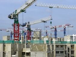 Building construction with cranes