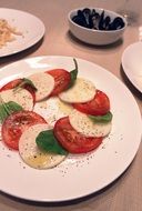 caprese salad with basil, italian cuisine