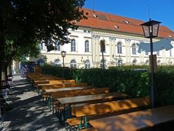 free tables in park at schloss dachau, germany, bavaria