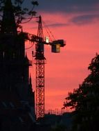 tower crane at purple evening sky