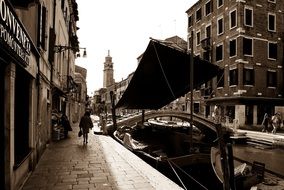 boat on channel at bridge, italy, venice