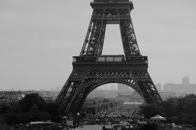 city view through the eiffel tower in black and white background