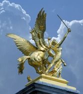 Fame of the War, golden statue at dramatic sky, france, paris