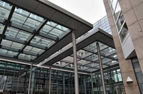 glass roofing construction at facade of modern building