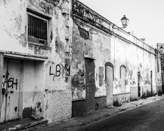 grunge walls of old buildings on abandoned street