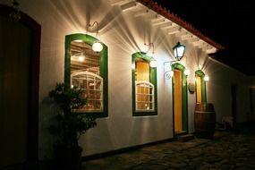 vintage lanterns on picturesque facade at night, brazil, paraty