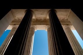 low angle view of modern stone columns at sky