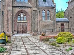 walkway to doors of old church, netherlands, oude pekela