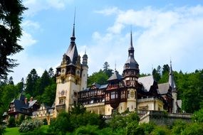 medieval castle at summer forest, romania, peles