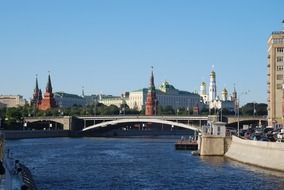 distant view of kremlin towers and church from river, russia, moscow