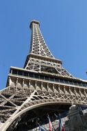 View from below on the eiffel tower against the blue sky