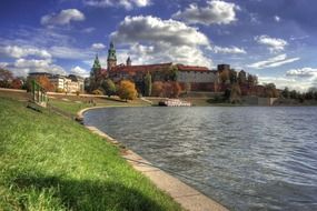 scenic view of old city on shoreline at autumn, poland, krakow